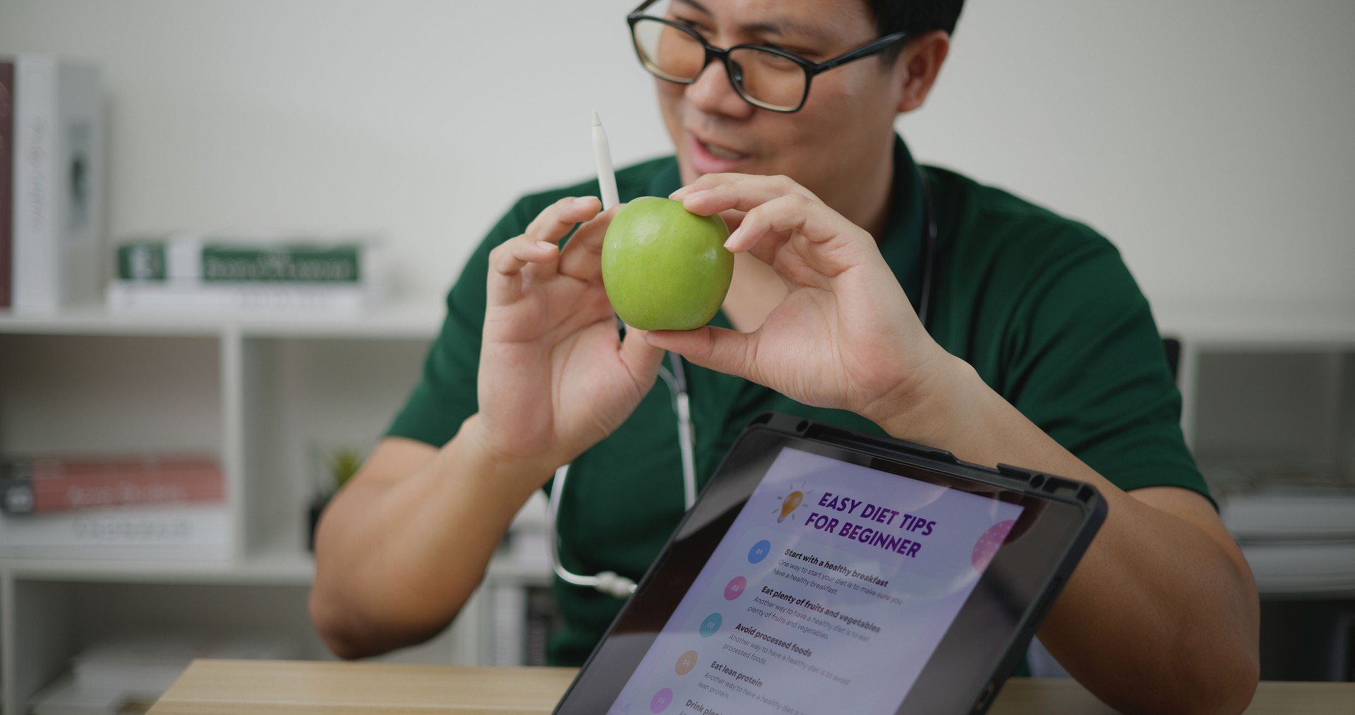 Professional nutritionist asian man consulting young woman use tablet